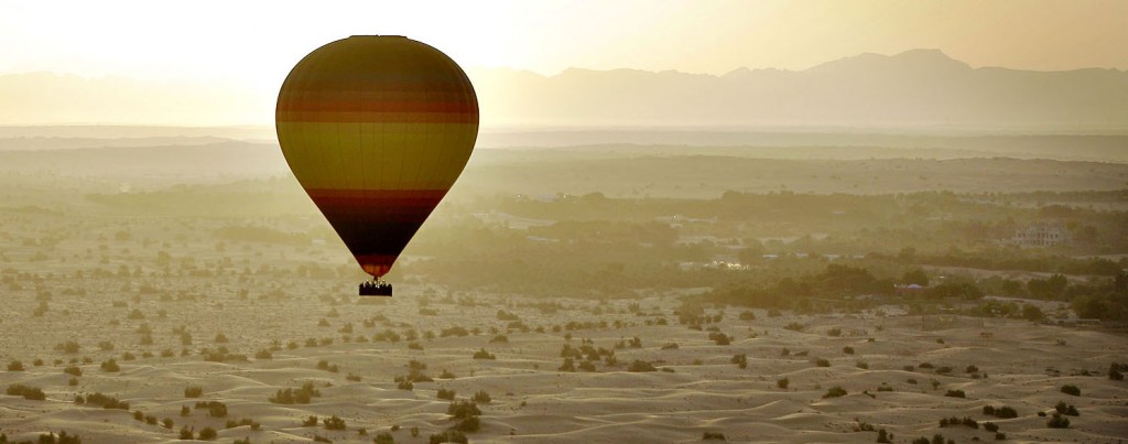 The sun rises from behind the Hajjar Mountains as one of the wor